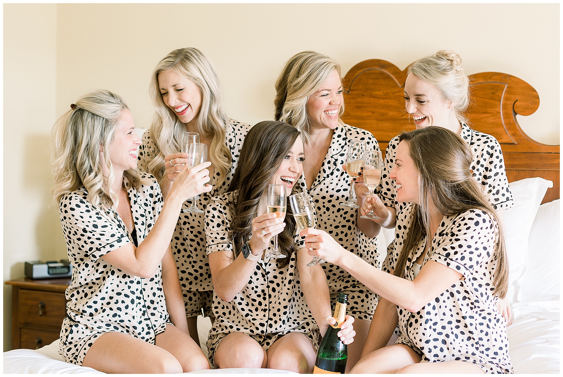 bride and bridesmaids toasting in pajamas at four seasons dallas