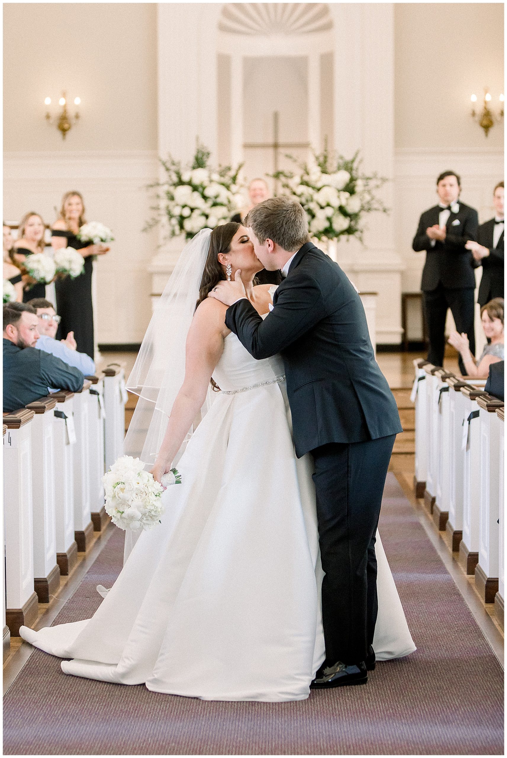 bride and groom kiss following i dos