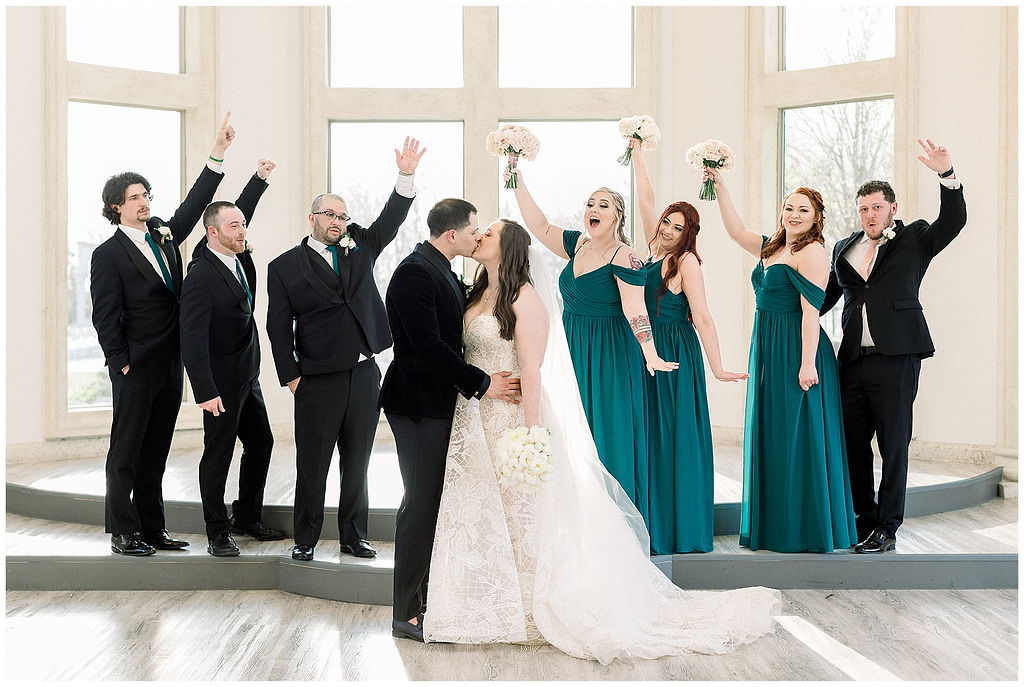 bridal party celebrating bride and groom