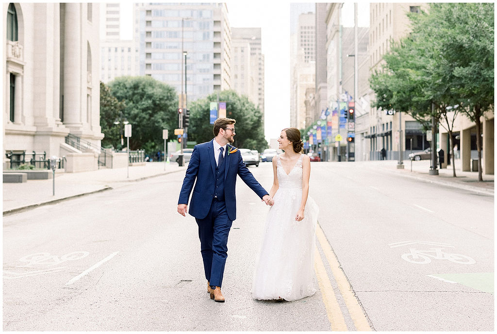 bride and groom walk street